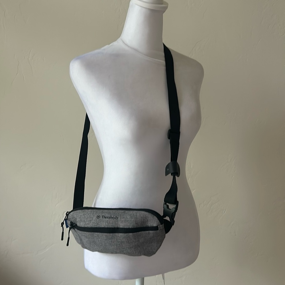 Therabody Crossbody/Fanny Pack Travel Pouch. With travel socks and Eye mask.